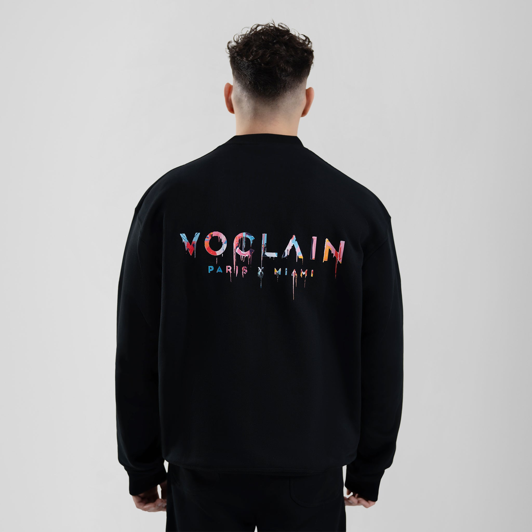 Model with Voclain Black Sweater